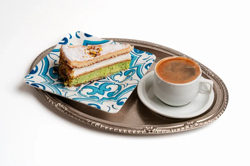 Pistachio cake with a cup of coffee