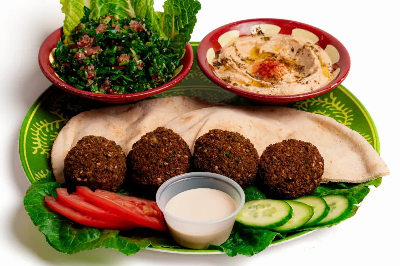 Falafel with flatbread, hummus, tabouli and vegetables