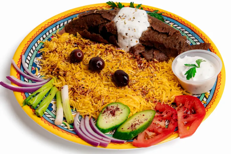 Gyro with yellow rice, olives and vegetables