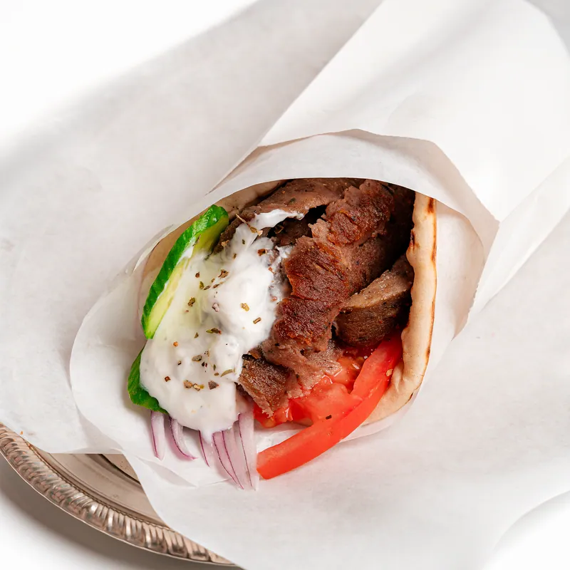 Gyro wrap with tomato, onion and cucumber