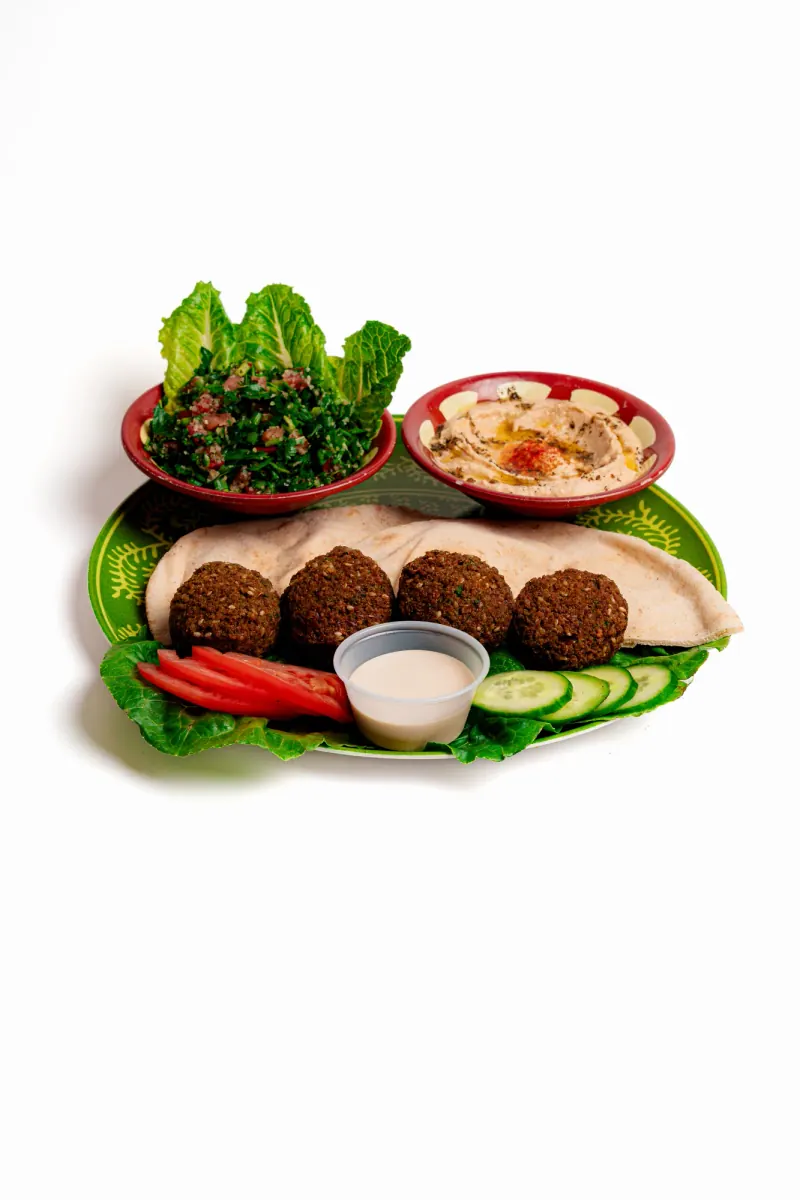 Falafel with flatbread, hummus, tabouli and sliced vegetables