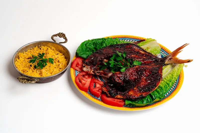 Baked fish with yellow rice