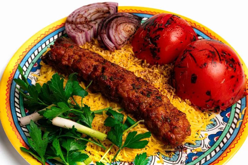 Chicken kabob over yellow rice