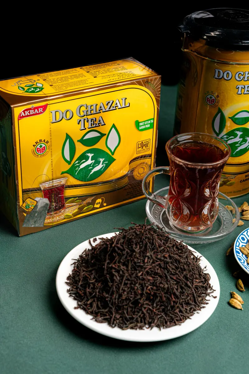 Cardamom tea, loose leaves and a glass of tea
